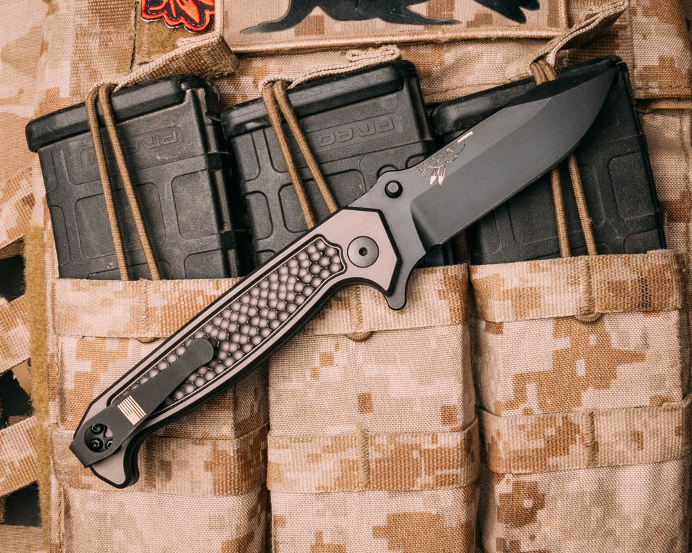 Disaster Folder, Anodized grey handle, nitride black blade, dimpled Grip, deep carry pocket clip