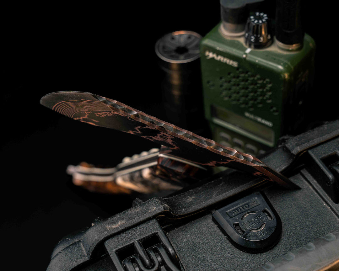 Recce Alpha Hawk- Baker Forge Random Patter CopperMai- Hawaiian Curly Koa, Black G10 and Copper Pin Striping, Dyed Giraffe Bone Split, Copper Pins, Half Face Mosaic Pin, Textured Grip