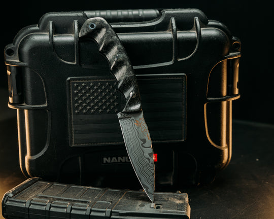 4" Humint- Baker Forge Stainless Steel Wavy Damascus- African Blackwood, Carbon Fiber, Mosaic Pins, Aluminum Lanyard Pin, Textured Grip