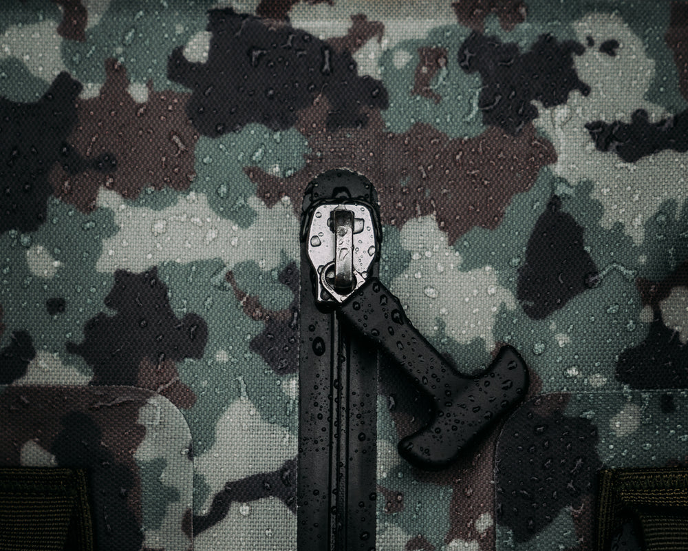 Uncharted Supply Co. x Half Face Blades - The Vault 65L Duffel Bag
