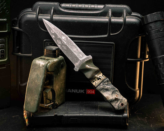 Combat Dagger- OD Green Canvas Micarta, Black G10, Desert Tan G10, OD Green G10 and Copper Pin Striping, Black Calceon Split, Buckeye Burl, Mosaic Pins, Copper Lanyard Pin, Textured Grip