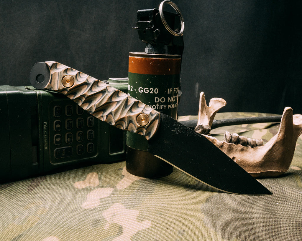 Crow Scalper- Camo G10, armor black cerakote, brass allen bolts, chaos grip