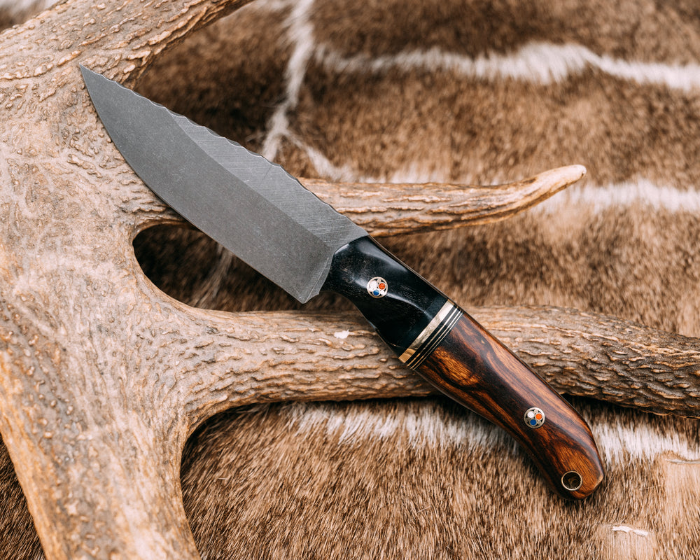 Crow Scalper- Rams Horn, Black G10 and Brass Split, Desert Ironwood, Patriot Mosaic Pins, Brass Lanyard Pin, Contoured Grip