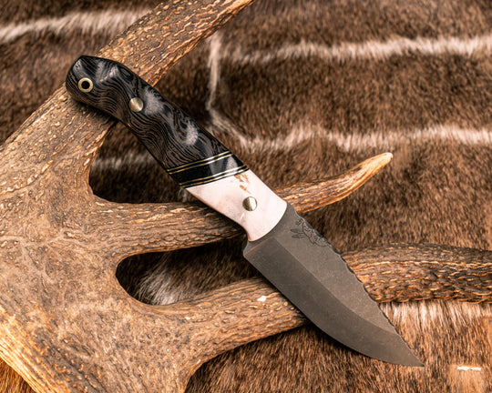 Crow Jr- CO Elk Antler, Black G10, Brass and Black Canvas Micarta Split, Ancient Bog Oak, Brass Pins, Brass Lanyard Pin, Textured Grip