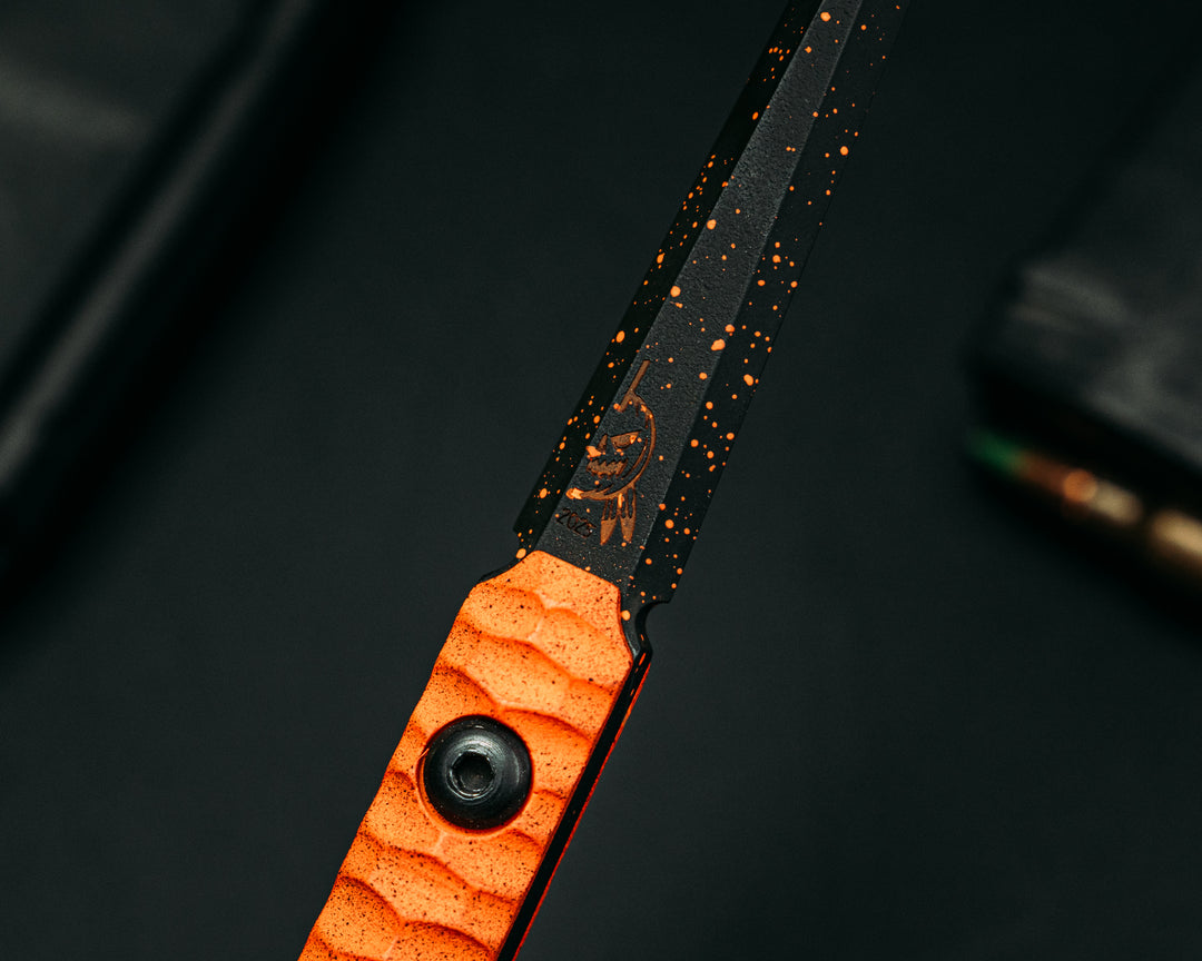 Cardiac Spike (2025 Halloween Edition)  - Hunter Orange G10, Armor Black Cerakote w/ Orange Splatter, Allen Bolts, Iron Grip.