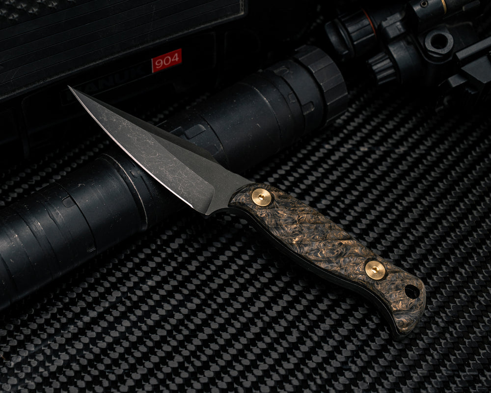 Gulo Gulo - Dark Matter Gold Carbon Fiber, Brass Bolts, Iron Grip.