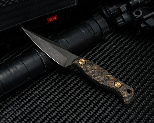 Gulo Gulo - Dark Matter Gold Carbon Fiber, Brass Bolts, Iron Grip.