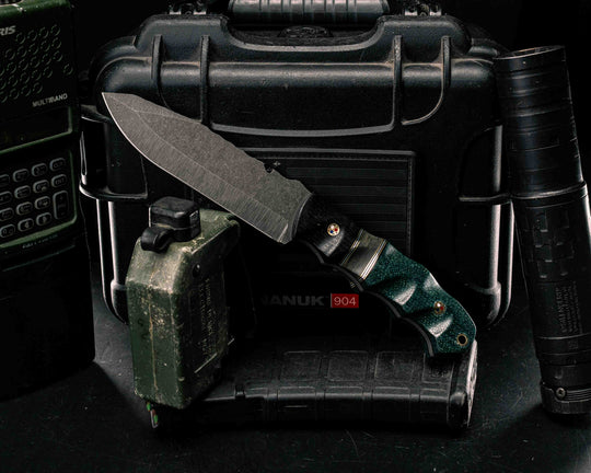 Notched Disaster Breacher- Ancient Bog Oak. Black G10, Brass and Aluminum Pin Striping, Navy S.E.A.L AOR 2 Canvas Micarta Split, Emerald Jut Micarta, Patriot Mosaic Pins, Brass Lanyard Pin, Textured Grip