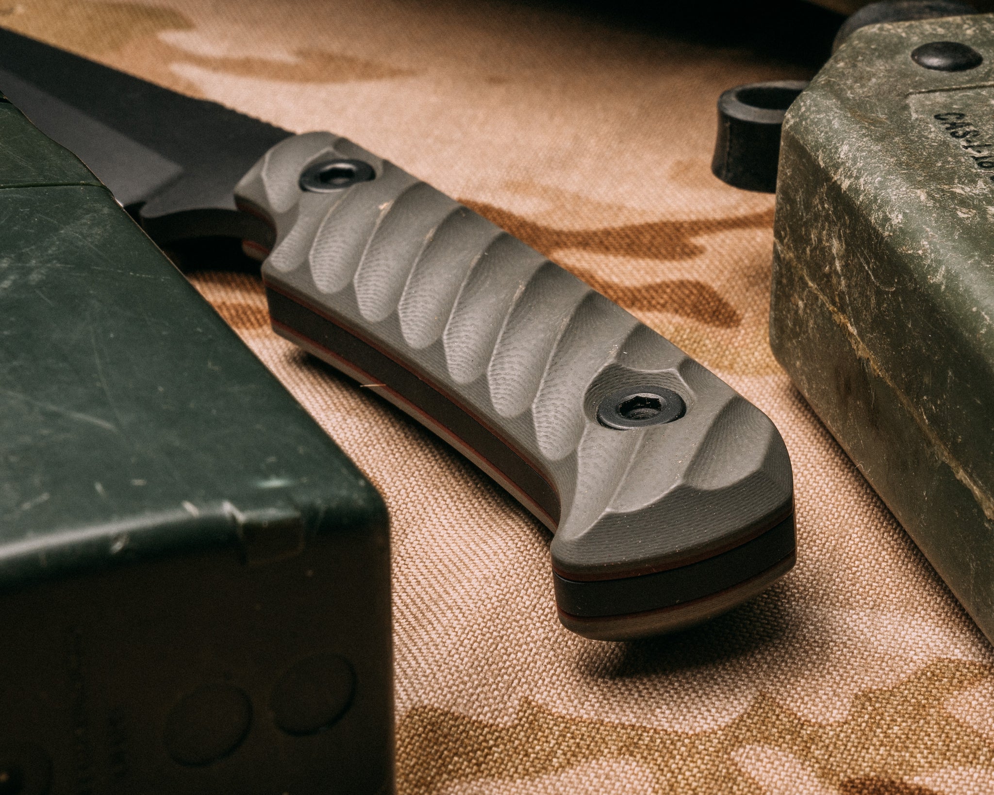 Boogeyman- charcoal grey with ruby G10 liner, armor black cerakote, allen bolts, iron grip