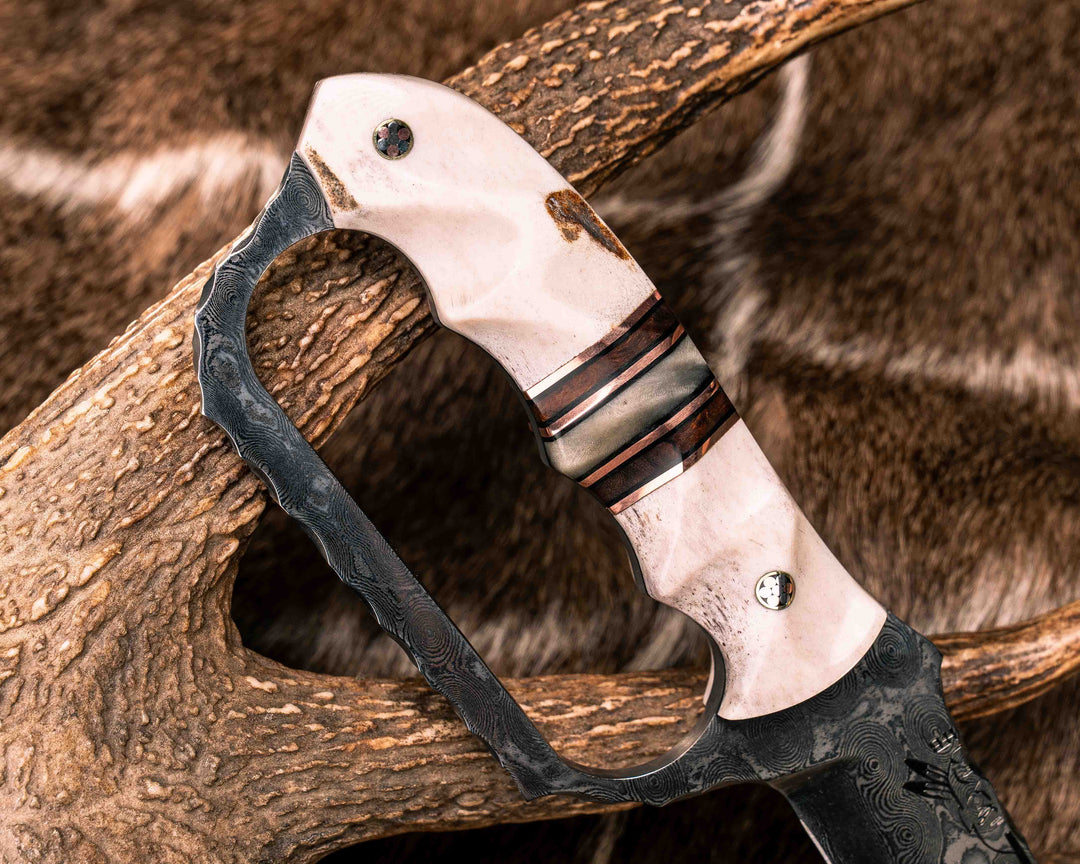 Trench Knife- Baker Forge Raindrop Damascus- Elk Antler, Black G10 and Copper Pin Striping, Desert Ironwood and Rams Horn Split, Mosaic Pins, Textured Grip