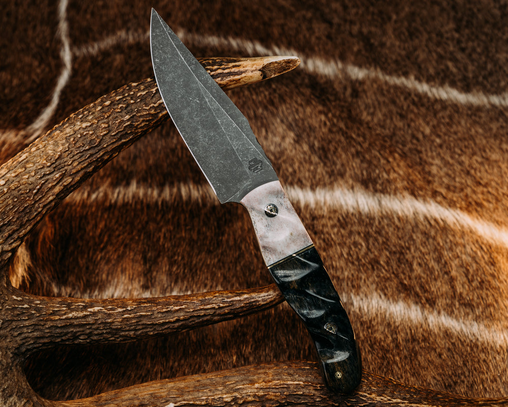 Crow Scalper- Elk Antler, Black G10 & Brass Split, Dyed Giraffe Bone, Textured Grip.