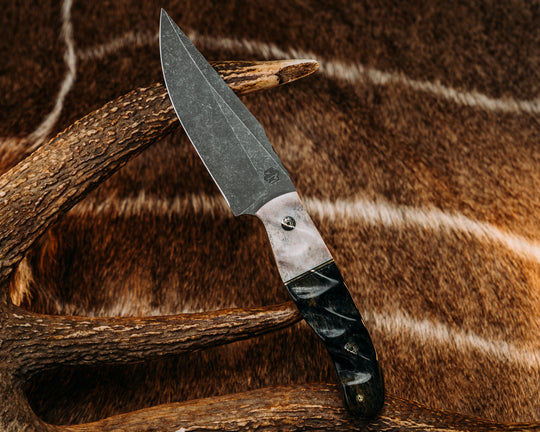 Crow Scalper- Elk Antler, Black G10 & Brass Split, Dyed Giraffe Bone, Textured Grip.