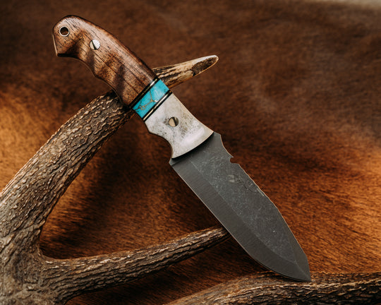Notched Disaster Breacher - Elk Antler, Black G10 & Brass Pin Striping, Turquoise w/ Gold Web Tru Stone Split, Hawaiian Curly Koa, Brass Pins, Textured Grip.