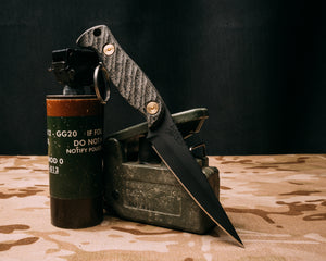 Congressman- Black Burlap micarta, Armor Black cerakote, brass allen bolts, iron grip