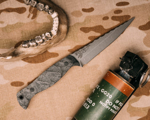 Congressman- Black canvas micarta, CF pins, chaos grip, rock work, closed tang