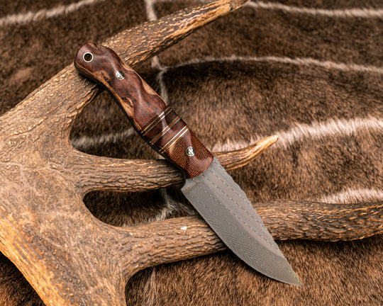 Crow Jr- Vegas Forge Herringbone Damascus, Brown Canvas Micarta, Natural Micarta, Black G10, Brass and Fiddleback Jarrah Split, Mahogany Over Mountain Ash, Mosaic Pins, Brass Lanyard Pin, Textured Grip