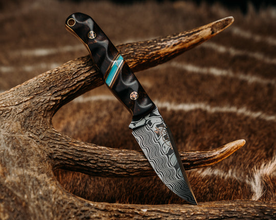 Crow Cub- Baker Forge Zeus Pattern Performance Stainless Damascus- Desert Ironwood, Natural Canvas Micarta, Black G10 and Brass Pin Striping, Turquoise with Gold Matrix Tru-stone Split, Mosaic Pins, Brass Lanyard Pin, Textured Grip