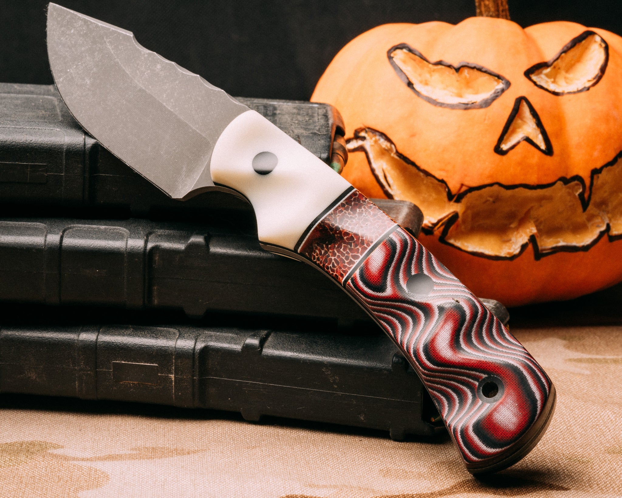 Beef Harpoon Point- white G10, black G10 and white G10 pin striping, giraffe bone in resin split, black white and red layered micarta, CF pins, CF lanyard pin, textured grip