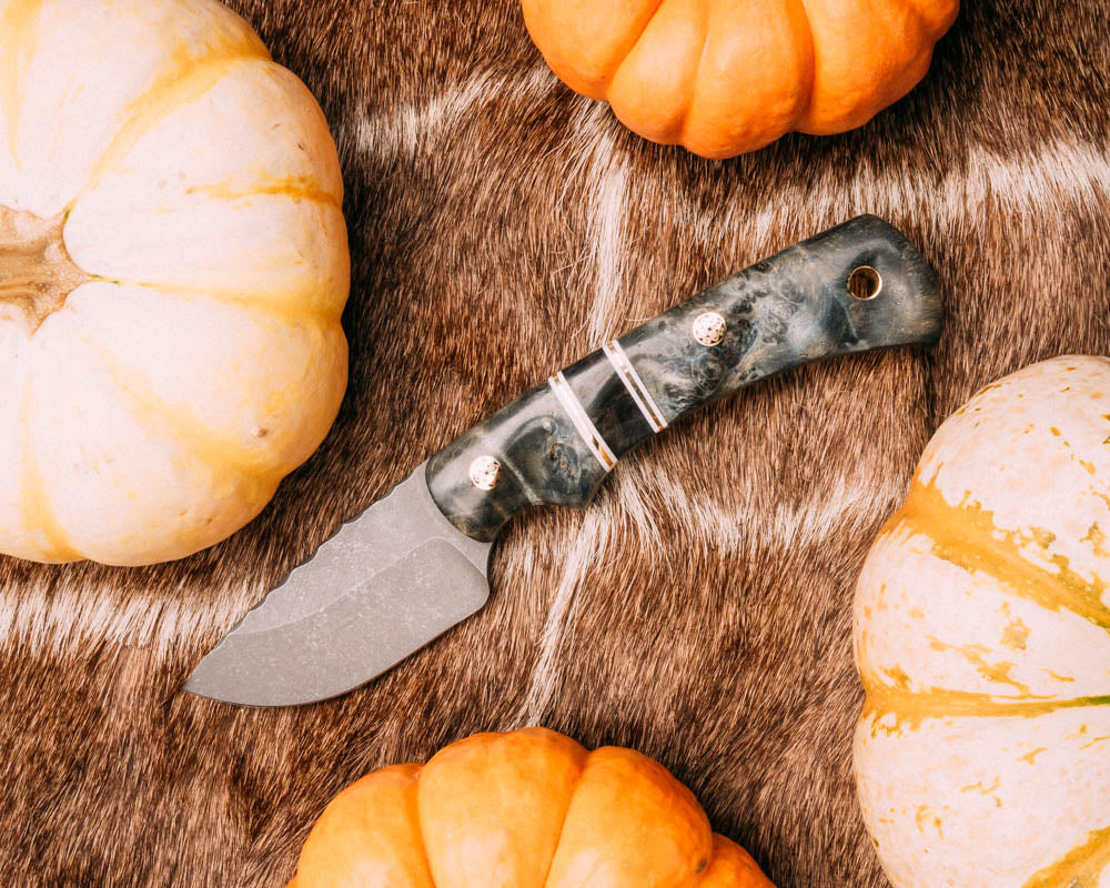 Beef - dyed buckeye burl, white G10 and brass pin striping, dyed buckeye split, mosaic pins, brass lanyard pin, contoured grip