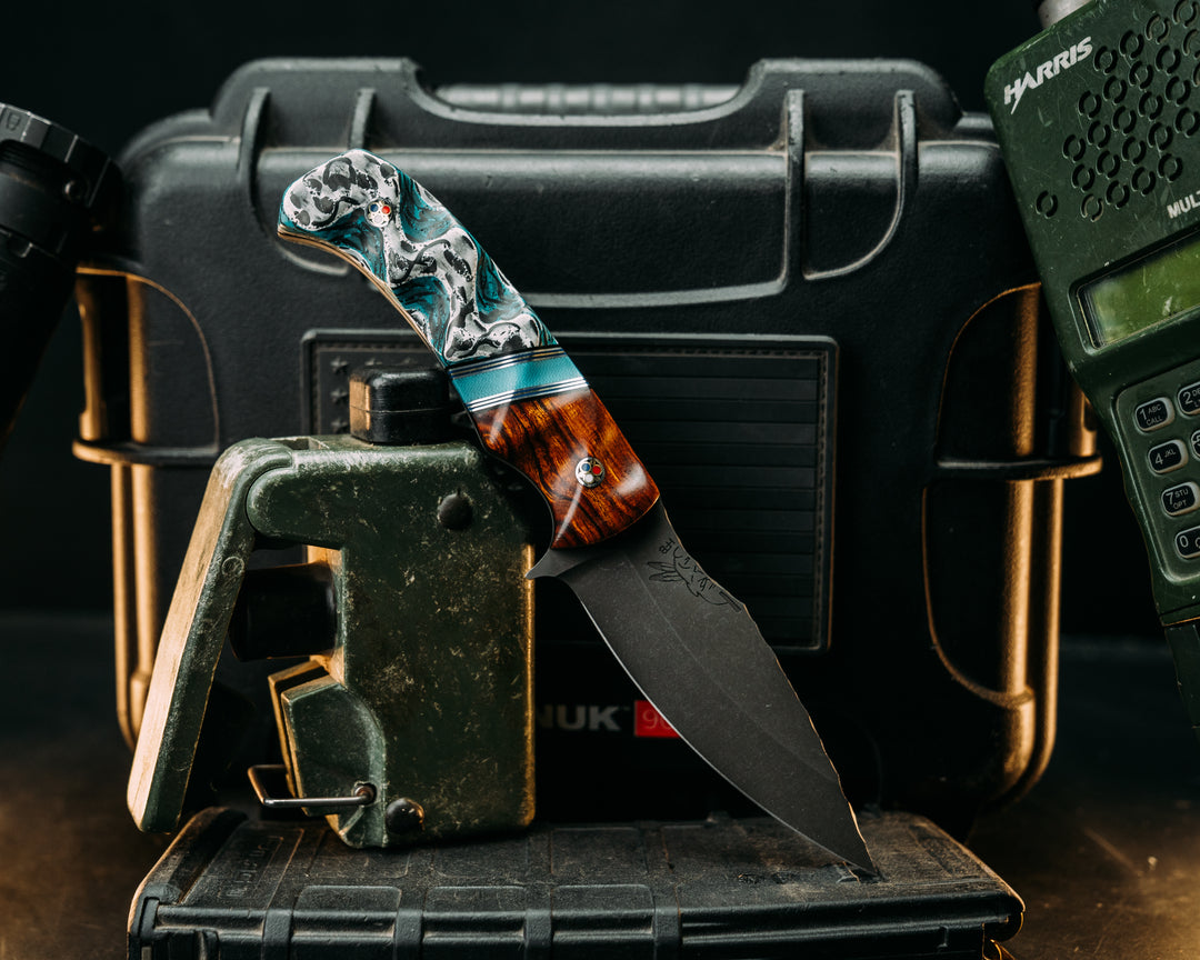 Ishi - Desert Ironwood, Black & Blue G10 w/ Aluminum & Brass Pin Stripping, Brittney Blue G10 Split, Winter Crow Carbon, Patriot Mosaic Pins, Textured Grip.