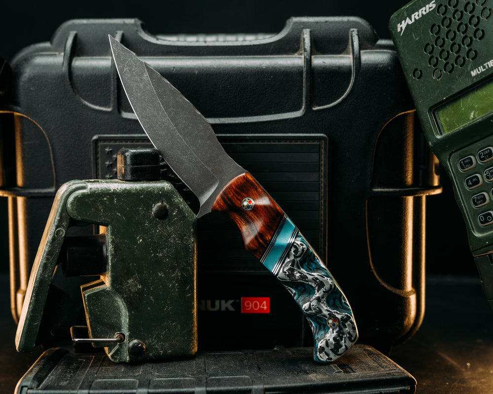 Ishi - Desert Ironwood, Black & Blue G10 w/ Aluminum & Brass Pin Stripping, Brittney Blue G10 Split, Winter Crow Carbon, Patriot Mosaic Pins, Textured Grip.