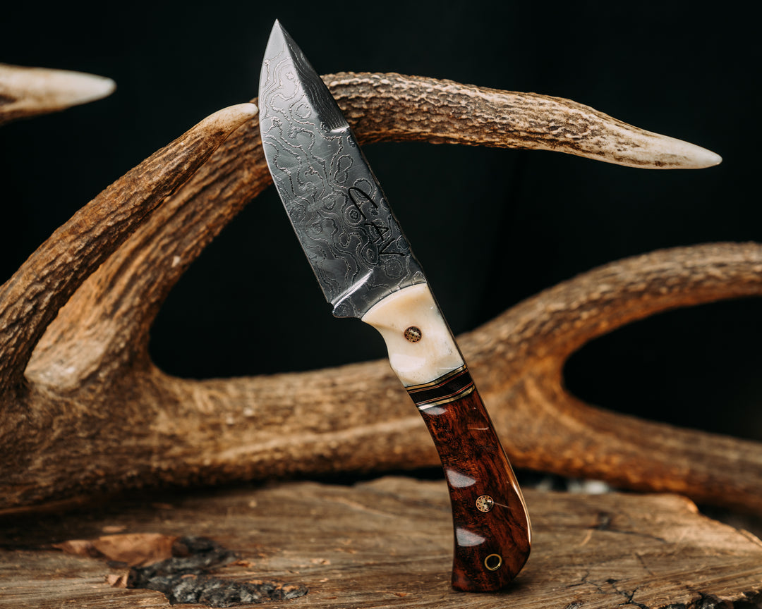 Cavner- Baker Forge Polished Random Pattern Damascus- Giraffe Bone, Black G10, Brass and Cherry G10 Pin Striping, Brown Canvas Micarta Split, Snakewood, Old School CAV Logo Mosaic Pins, Brass Lanyard Pin, Textured Grip